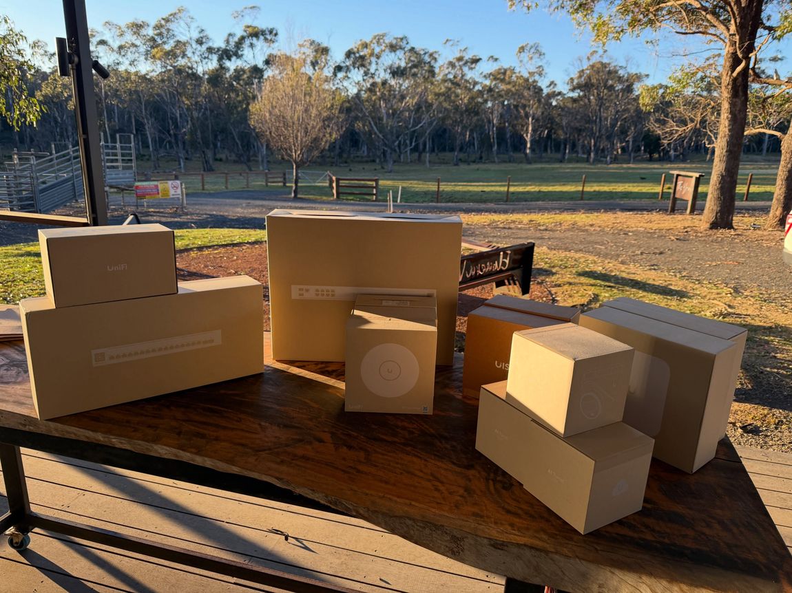 Networking equipment boxed and staged before installation on a rural property